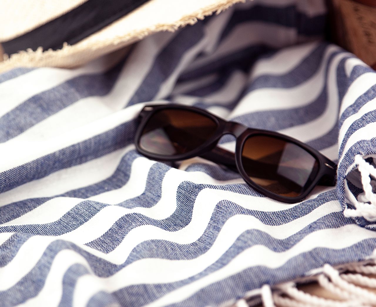 Beach towel on sand in the sun